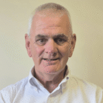 Photo of a smiling man.
